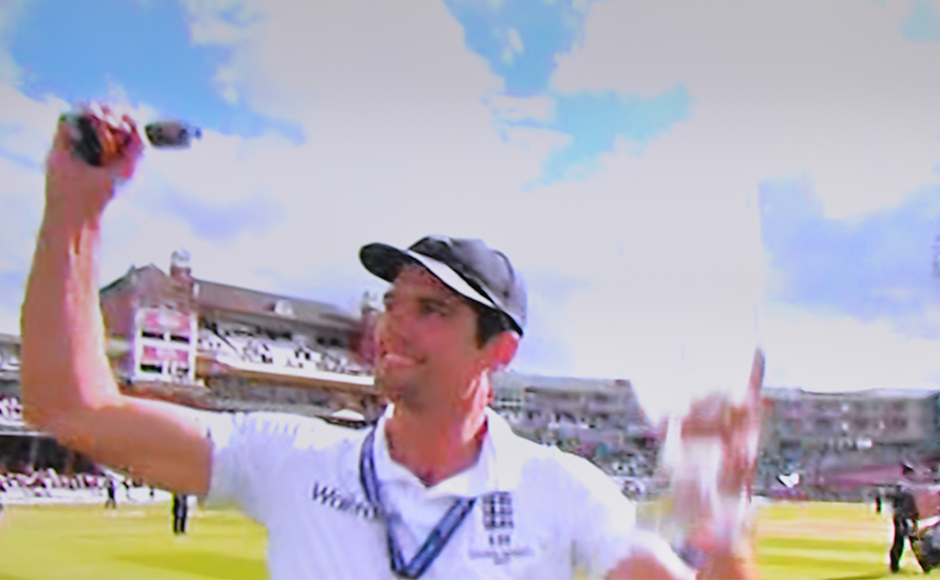 Alistar Cook  lifting the Ashes urn.