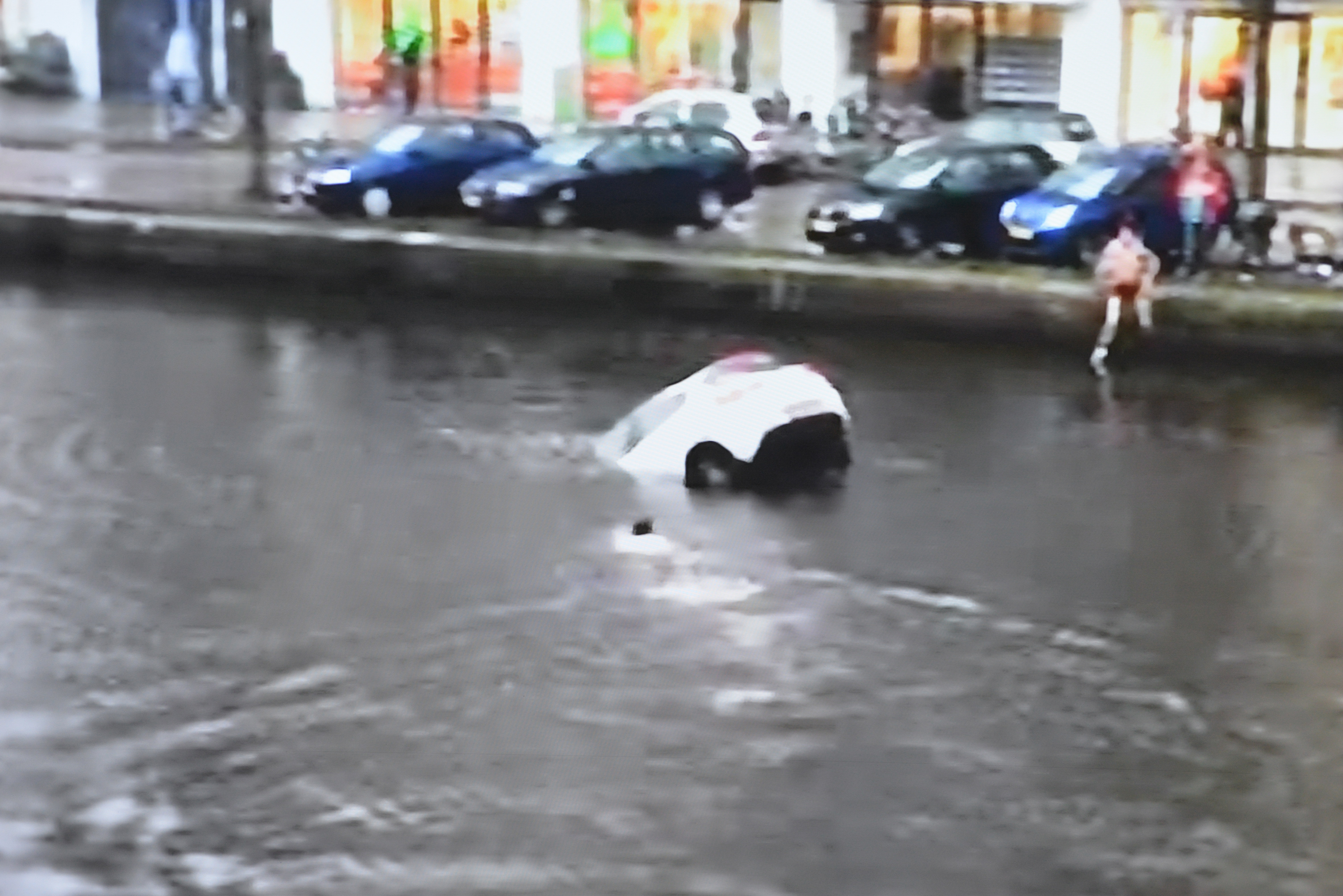 Car plunges mother and baby rescued