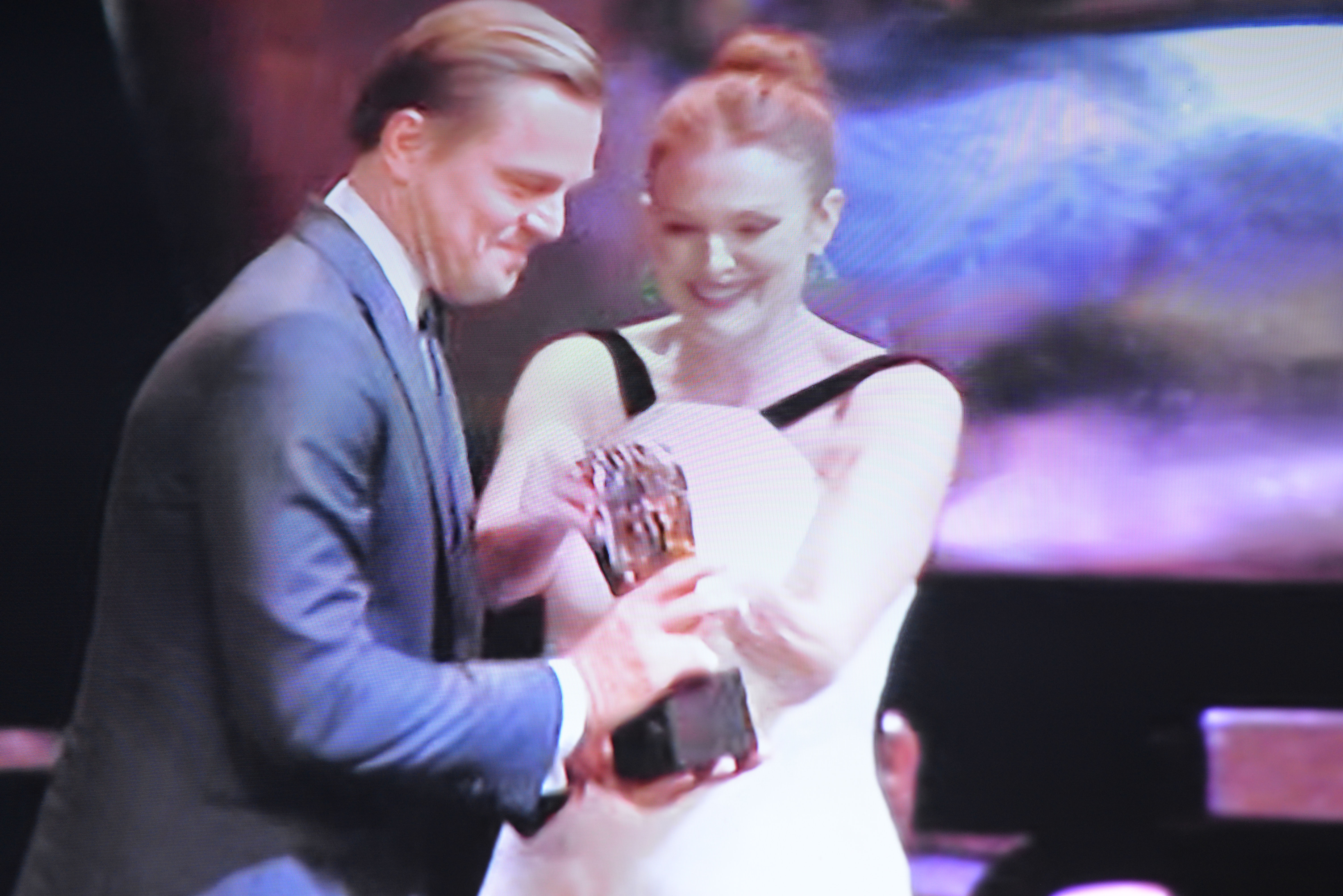 Leonardo receiving Best Actor BAFTA FROM Julia Moore