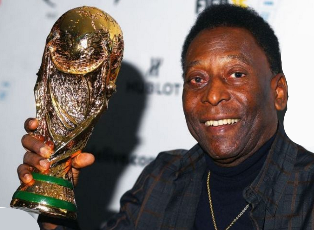 Pele with World Cup winning trophy