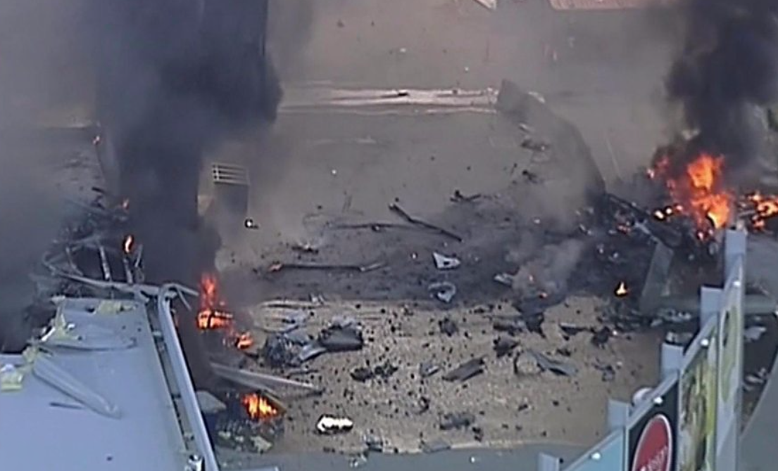 Twin engine plane crashes into Melbourne shopping complex.