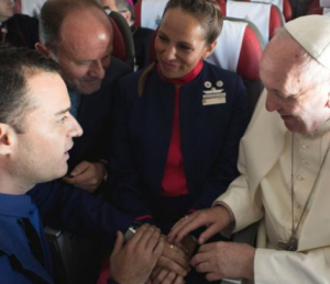 The Pontiff marrying the happy couple onboard Latam
