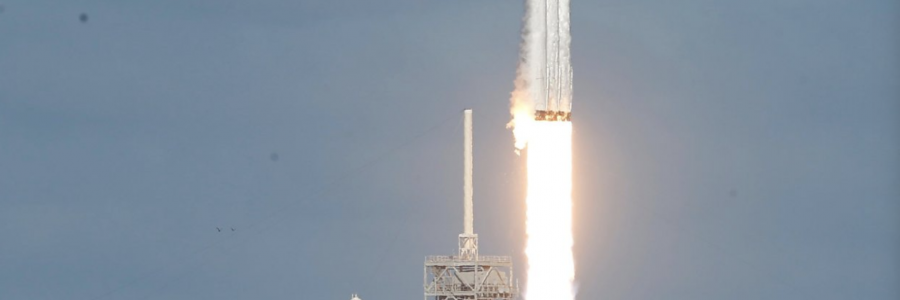 Flacon lifts off with Elon Musk's red Teslar