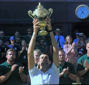 Novak Djokovic lifting Wimbledon trophy