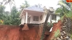 House hanging in Kerala after a landslide underneath