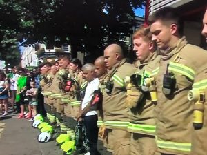 firemen observe one minute silence at the Notting Hill Carnival