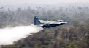 Hercules C-130 of Brazil’s Air Force dropping water to fight the fire at  the Amazon forest in the state of Rondonia, Brazil on 25 August 2019. Around 44, 000 soldiers were deployed in the vast Amazon regions to fight the forest fire in the sates of Rondonia, Roraima, Tocantins, Para, Acre and Mato Grosso.