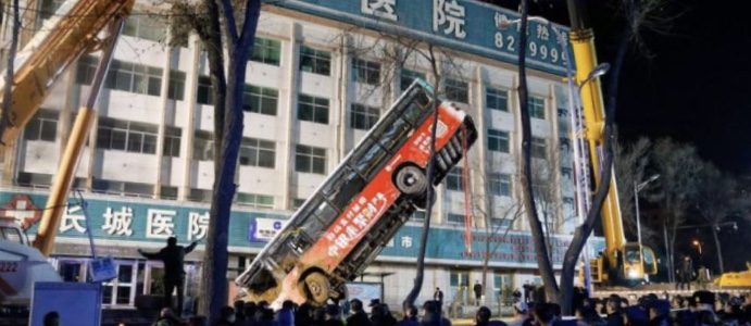 A sinkhole which opened up in the bus stop in Xining, North west China kills  six