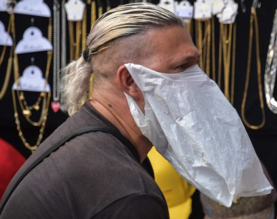 A vendor in Sao Paulo with makeshift mask against coronavirus