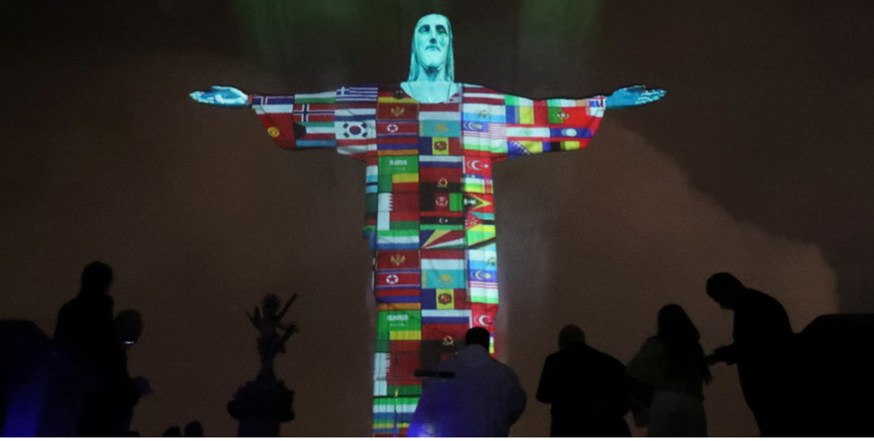 The statue of Christ the Redeemer is lit up in the colors of the countries that are affected by the coronavirus disease (COVID-19) outbreak in Rio de Janeiro 