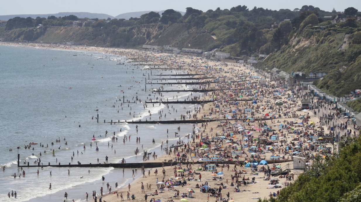 People are hot weather on Durley and Alum chine beaches in Dorset.