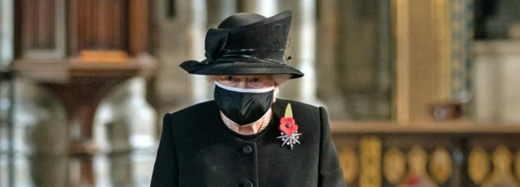 Masked Queen Elizabeth visits grave of unknown Warrior at Westminster Abbey