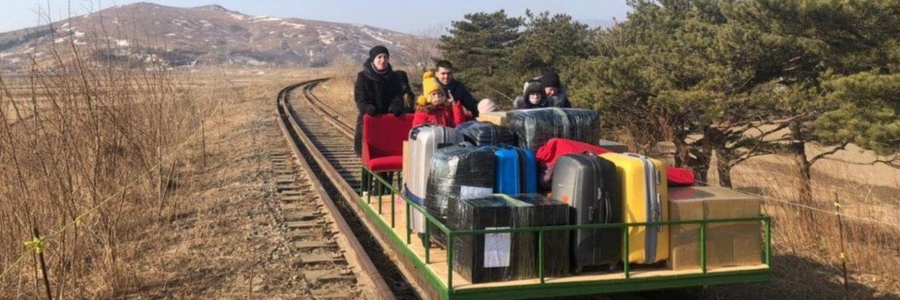 Russian Diplomats exiting North Korea by hand pushed trolley