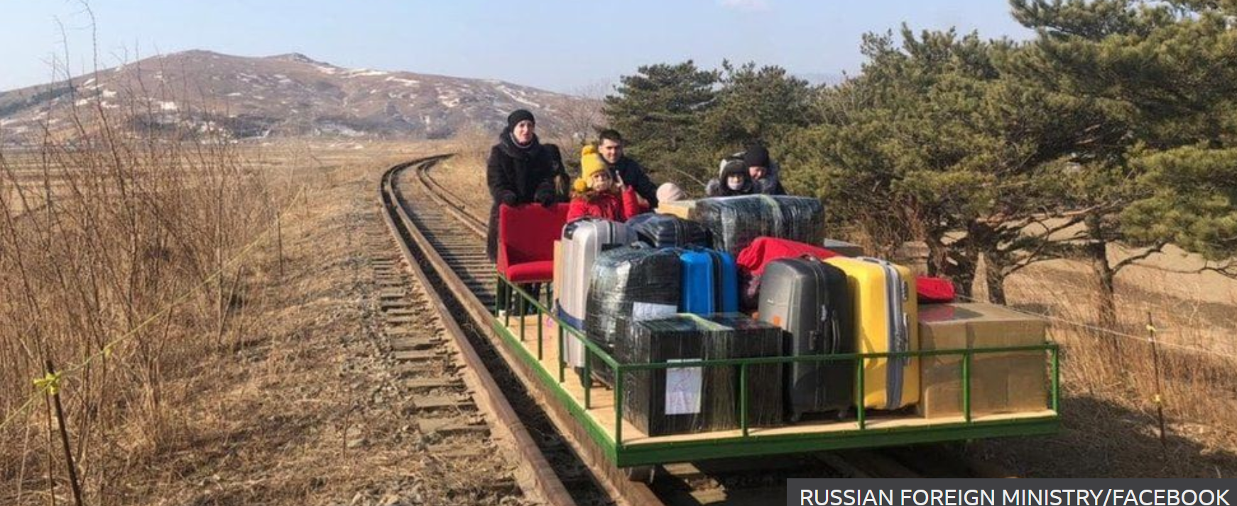 Russian Diplomats exiting North Korea by hand pushed trolley