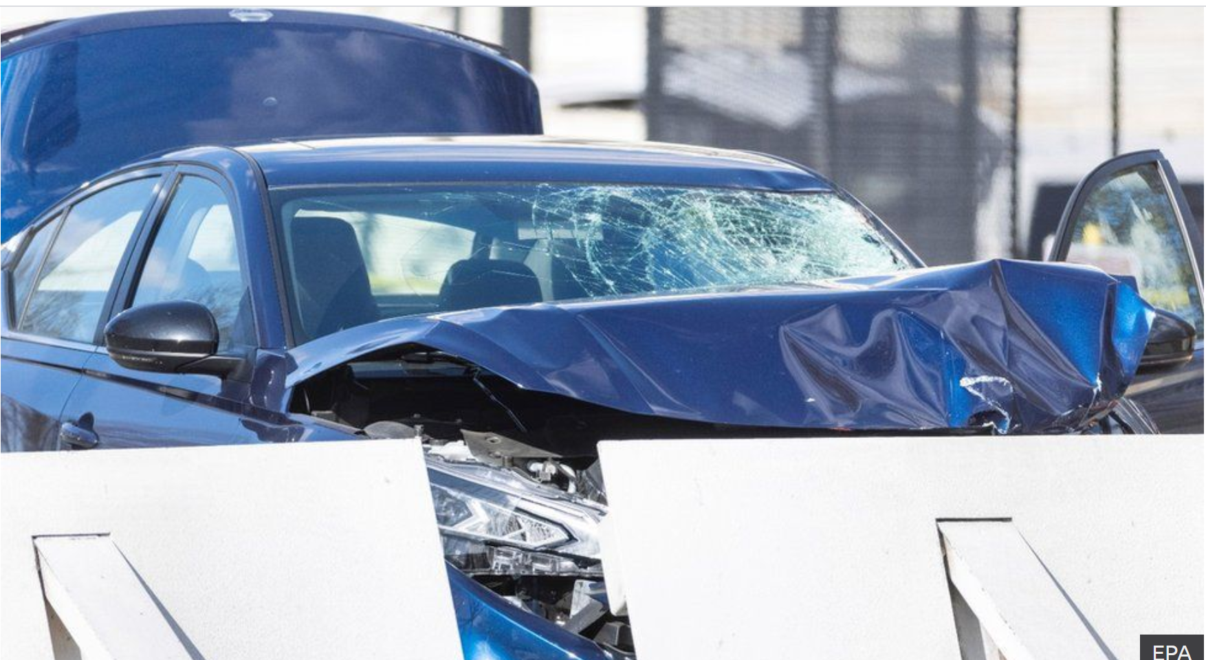 Sedan rammed into barrier killing a officer