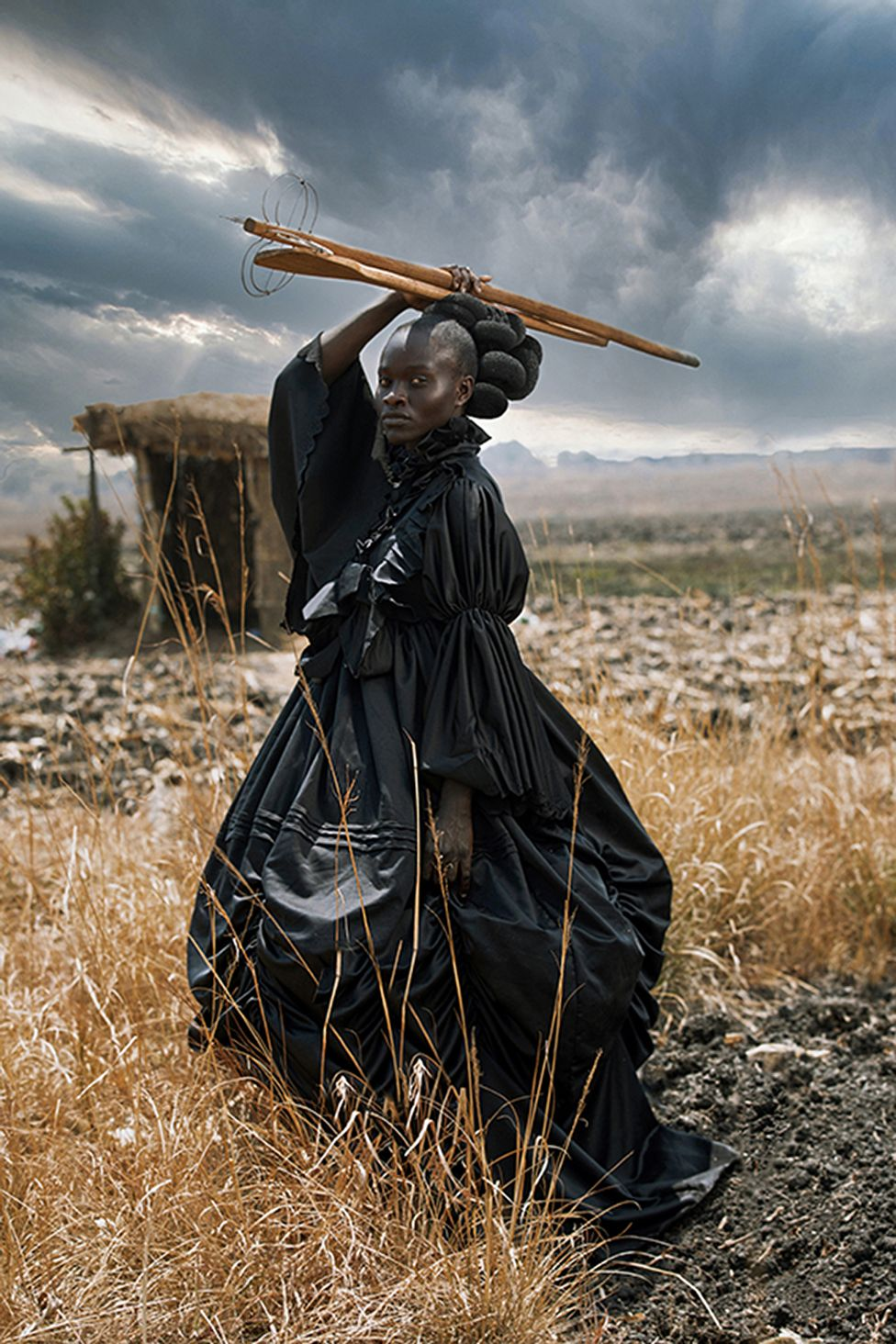 Tamary Kudita, from Zimbabwe, for her portrait of a young women dressed in Victorian clothing, holding traditional Shona cooking utensils called African Victorian. won the opne competition