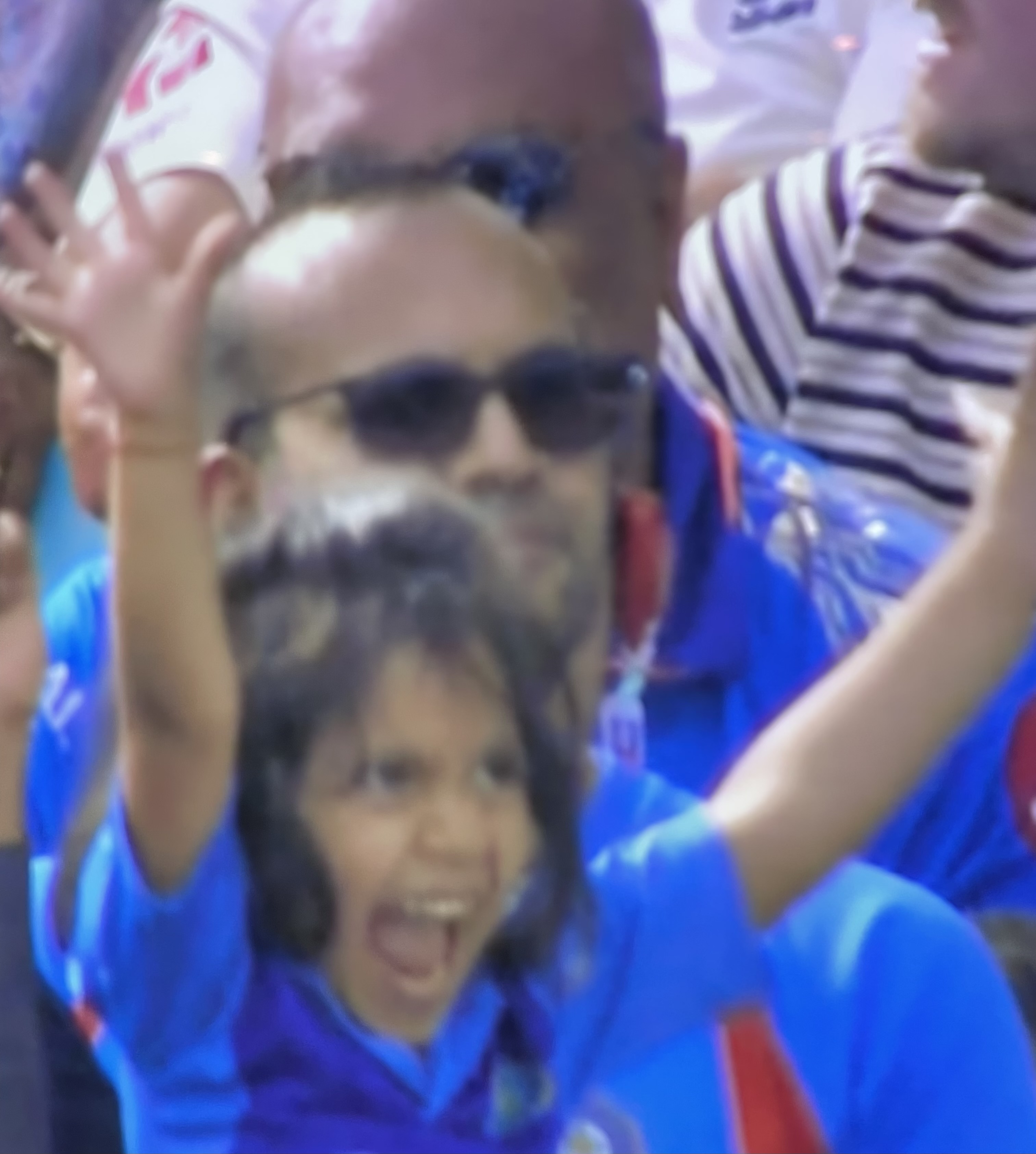 Young fan cheering Indian victory