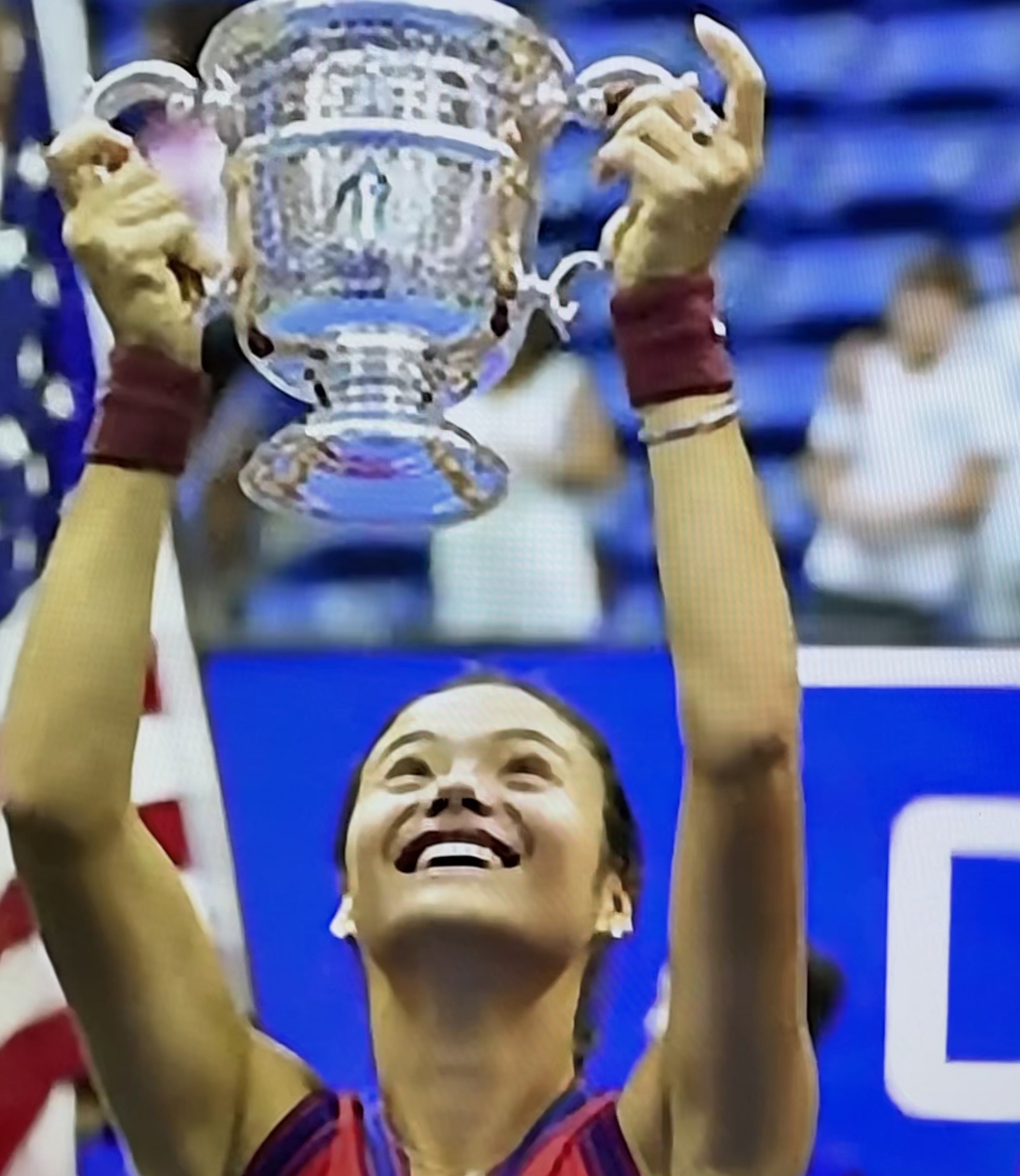 Emma Raducanu lifting the coveted US Open trophy