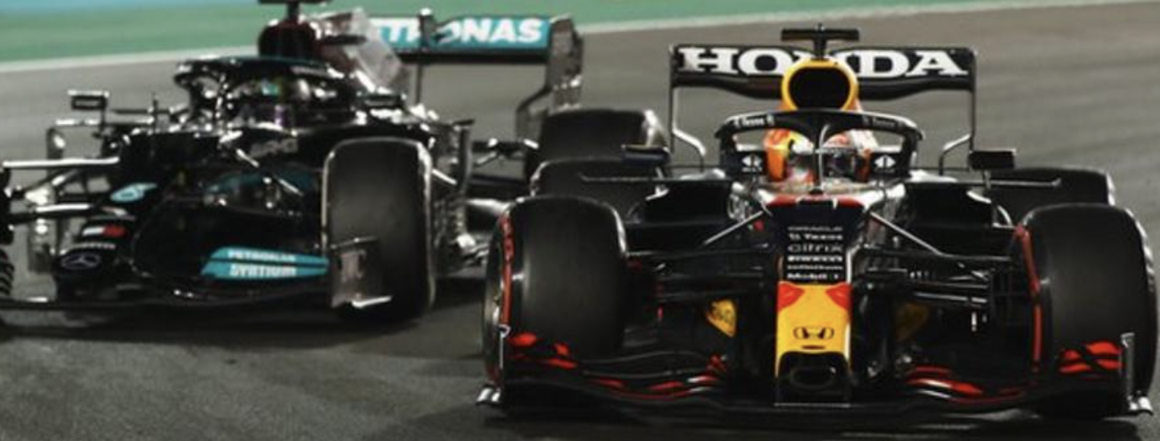 Max Verstappen overtaking Lewis Hamilton and piping him of the F1 world title