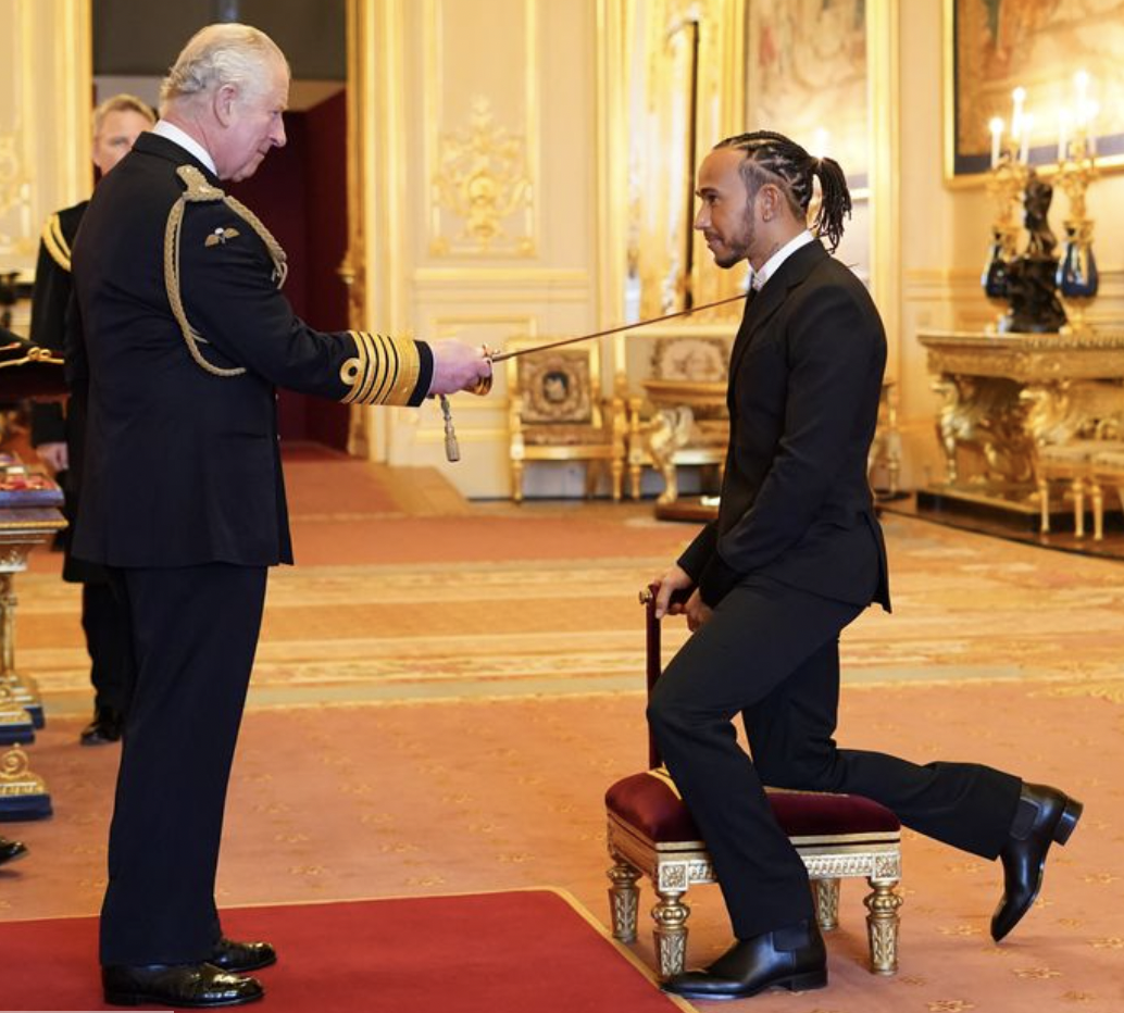 Lewis Hamilton being Knighted by Prince Charles at Windsor.