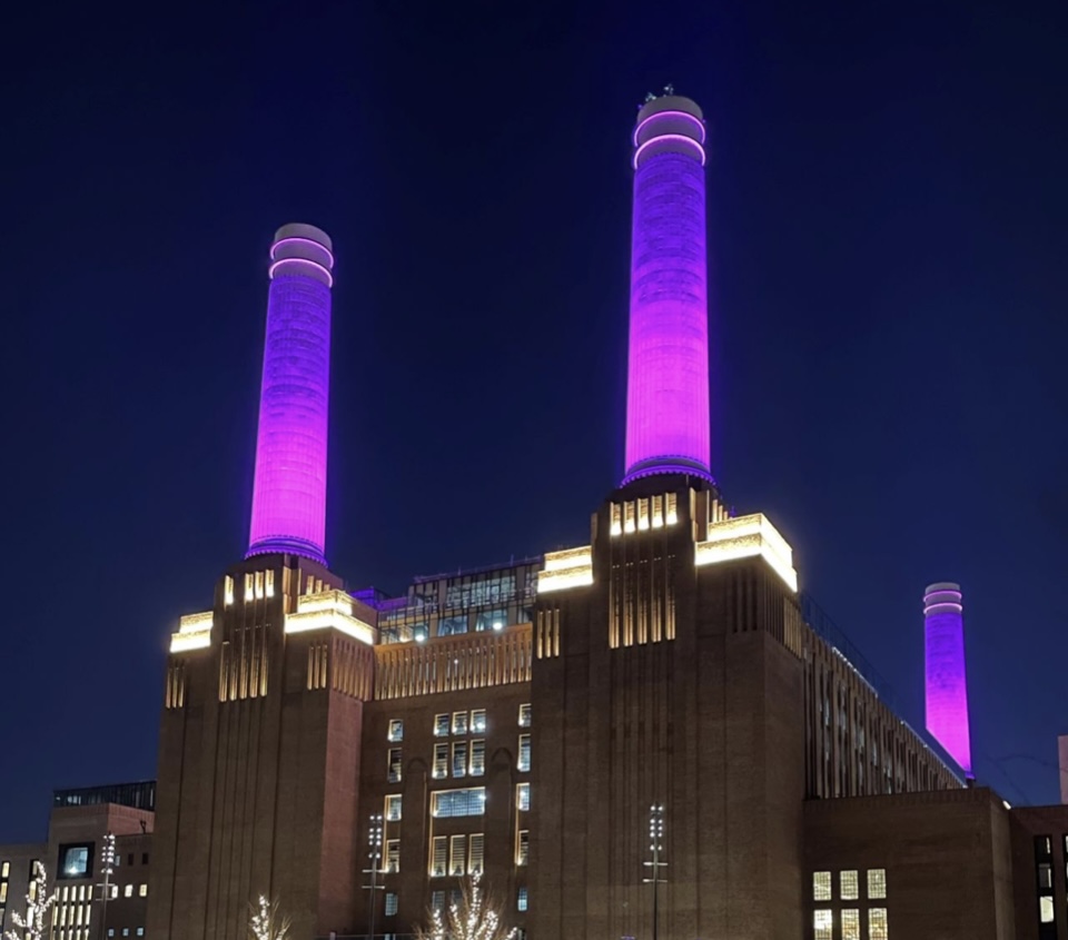 Battersea Power Station Chimneys lit up in purple to take part in