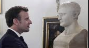 French President Emmanuel Macron viewing bust of Napolean