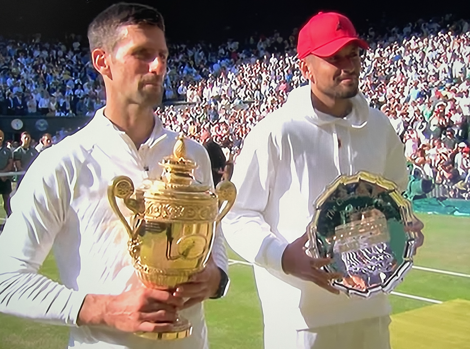 Djokovic and Kyriouswith trophies