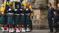 the Queen's coffin arrives at the Palace of Holyroodhouse in Edinburgh.