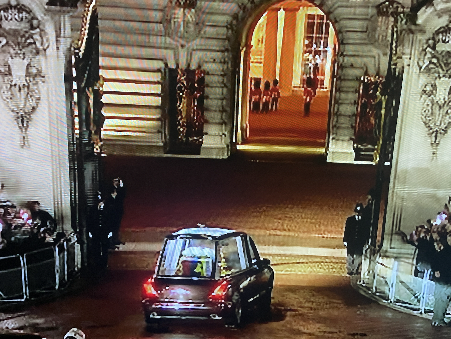 The Queen's coffin enters Buckingham Palace gates.