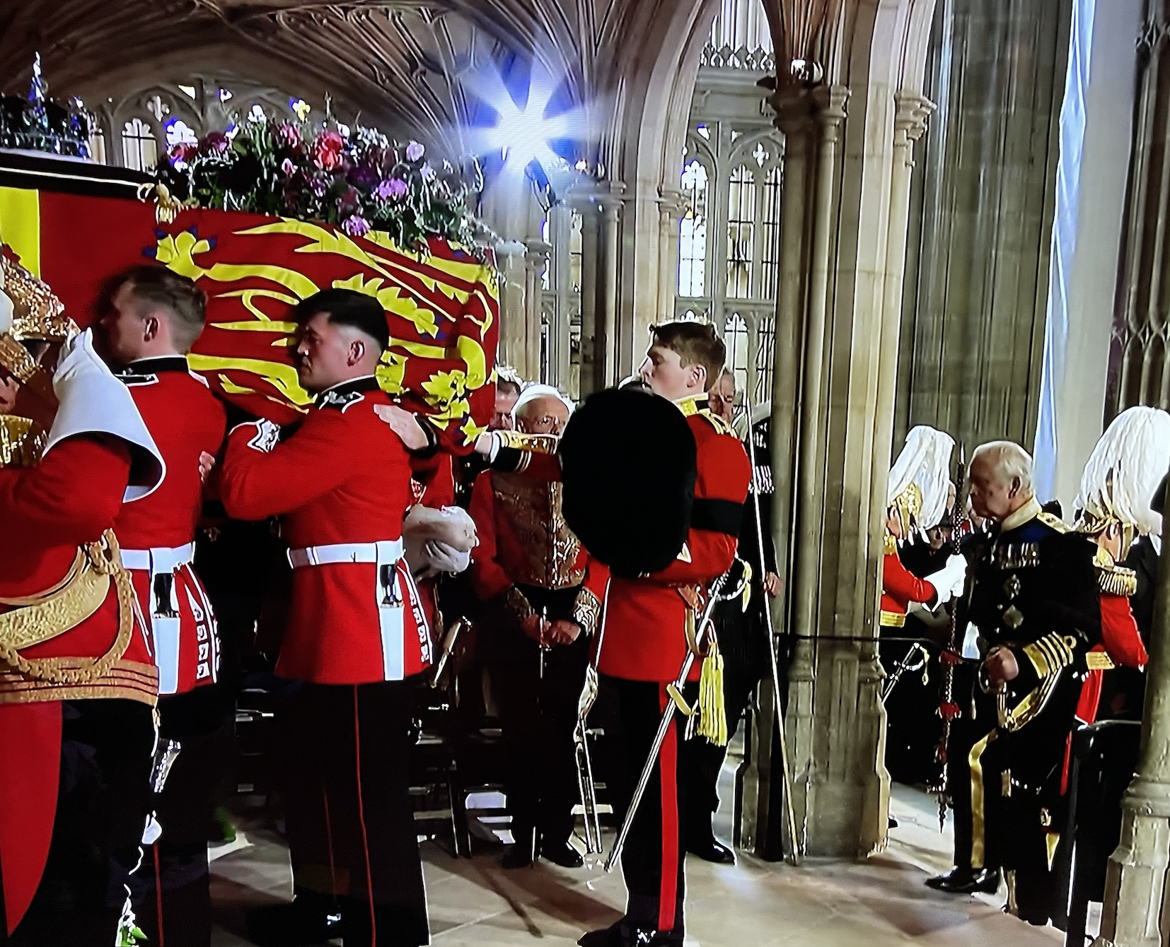 KIng Charles following his mum's coffin